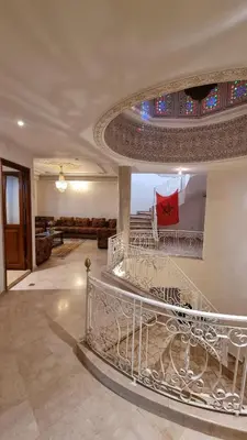 a staircase in a house with a glass ceiling at Villa with riad style in Fès