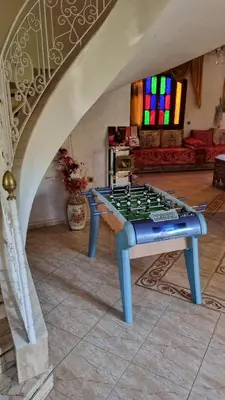 a chess table in the middle of a living room at Villa with riad style in Fès