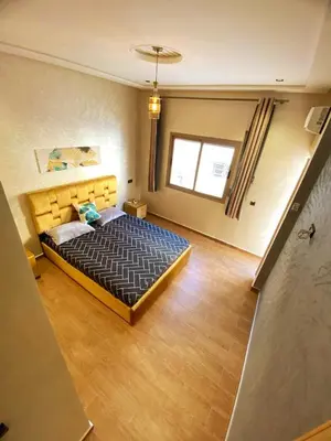 a bedroom with a large bed in a room at (1) Appartement calme in Fès