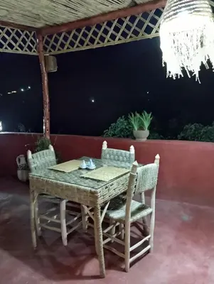 a table and chairs sitting on a patio at DAR DANI café restaurant in Boumalne
