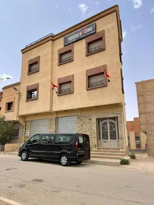 a black van parked in front of a building at Jaddou Home in Midelt