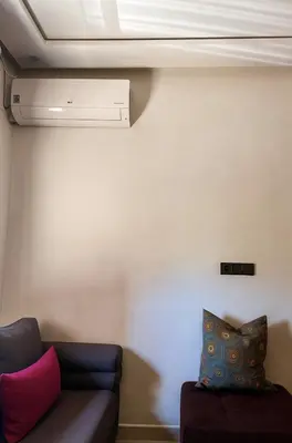 a living room with a couch and a ceiling at Serenity apartments in Azrou