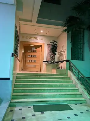a building with stairs in front of a door at Luxe & Air Conditionner & Calme appartement in Fès
