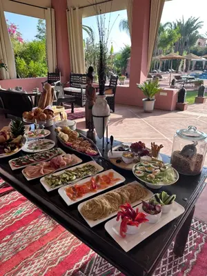 a buffet of food on a table in a resort at Maison Amâra Marrakech in Marrakech