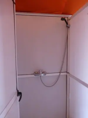 a closet with a hose hooked up to a door at Majestic Mirage Camp in Merzouga