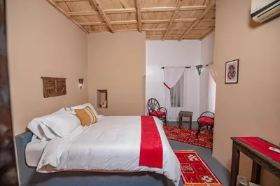 a bedroom with a large bed in a room at Kasbah Tiziri in Kalaat MGouna