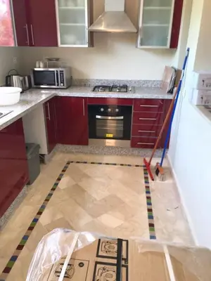 a kitchen being remodeled with a stove and a floor at Sliwa house la Perle de la ville Ocre in Marrakech