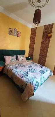 a bedroom with a bed in a room at Hébergement sabrina in Fès