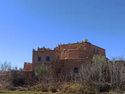 an abandoned house on a hill in the desert at Trésors des Ancêtres in Ibrahene