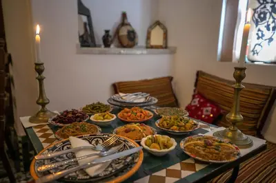 a table with many plates of food on it at Dar Authentic Fes - familly hosting in Fès