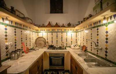 a kitchen with a sink and a counter top at Dar Authentic Fes - familly hosting in Fès
