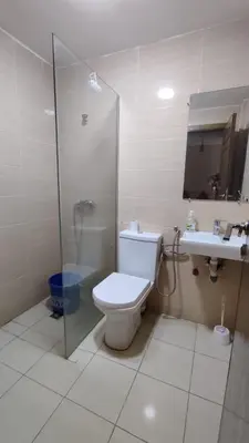a bathroom with a toilet and a shower and a sink at coin famille in Fès