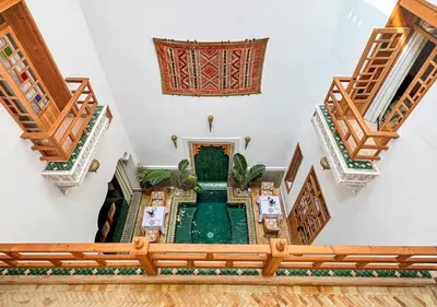 an overhead view of a building with a fountain at Riad Dar Timrad in Fès
