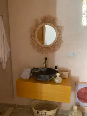a bathroom with a sink and a mirror at Alibaba Riad in Fès