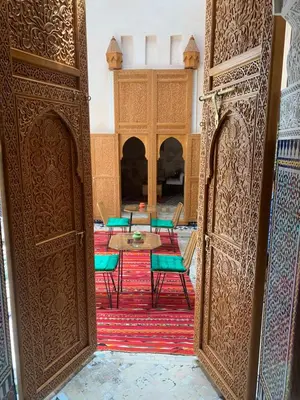 an open door to a room with a table and chairs at Alibaba Riad in Fès
