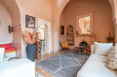 a living room with a couch and a fireplace at Villa Izza in Marrakech