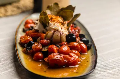 a plate of food on a table at Riad Villa Amood in Merzouga