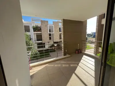 an open balcony with a view of a building at Prestigia luxury home in Fès