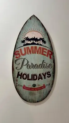 a sign on a wall that reads summer panhandle holidays at luxury Apartment Near Stadium and Airport in Fès
