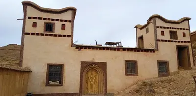 a building with a cow sitting on top of it at Dar Laayoune in Kalaat MGouna