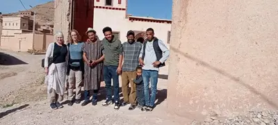 a group of people standing next to a building at Dar Laayoune in Kalaat MGouna