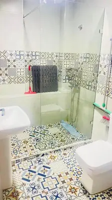 a bathroom with a shower and a toilet and a sink at welcome to fez in Fès
