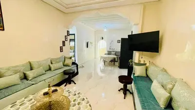 a living room with a couch and a table at welcome to fez in Fès