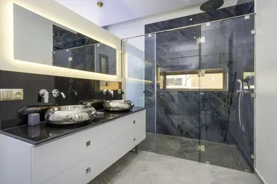 a bathroom with two sinks and a shower at Villa Seyana master, piscine privée, sans vis à vis in Marrakech