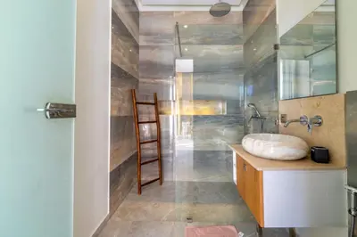 a bathroom with a sink and a wooden ladder at Villa Seyana master, piscine privée, sans vis à vis in Marrakech