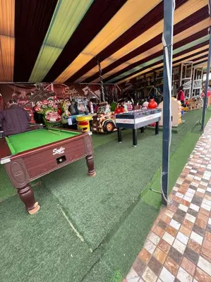 a store with a pool table in front of it at Villa1 des tortues Marrakech in Aït Zat