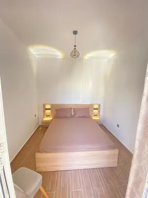 a bedroom with a large bed in a room at طريق صفرو in Fès