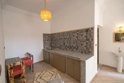 a bathroom with a sink and a counter top at Dar Diafa in Merzouga
