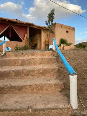 a set of stairs in front of a house at Les cavaliers chez Yassine in Marrakech