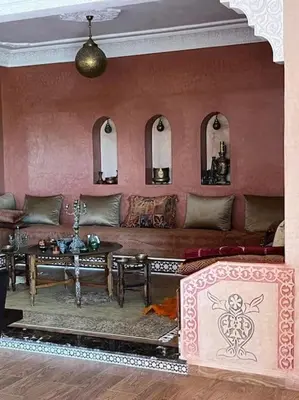 a living room with a couch and a table at belle ferme a louer in Tiflet