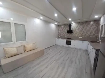 a large living room with a couch and a tv at Maison familiale avec piscine privée sans vis à vis in Tarhia