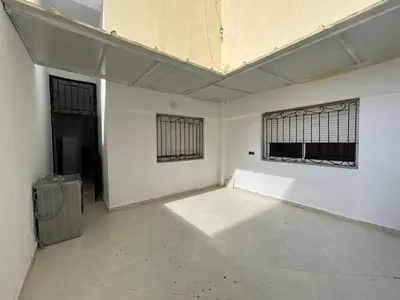 an empty room with two windows and a ceiling at appartement meublee a louer sur Fes in Fès