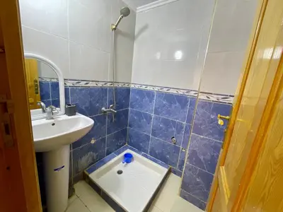 a small bathroom with a sink and a toilet at appartement meublee a louer sur Fes in Fès