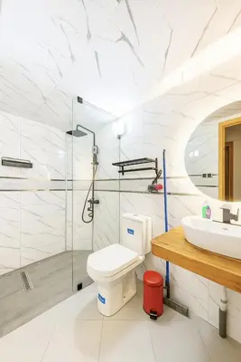 a bathroom with a toilet and a sink at Appartement avec un style de chalet in Azrou