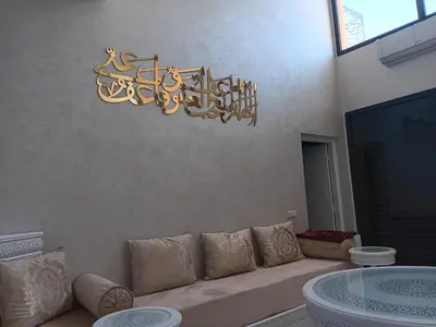 a chandelier hanging above a couch in a living room at Villa Jamel Marrakech Zac in Marrakech
