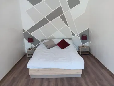 a bedroom with a white bed and two lamps at Villa Jamel Marrakech Zac in Marrakech