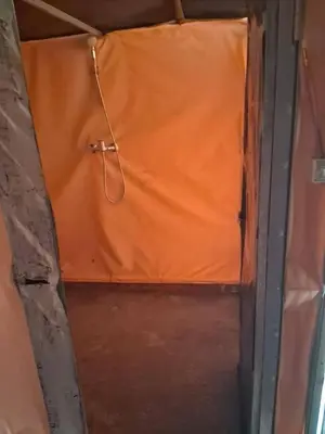 a room with an orange sheet on the wall at Unforgettable Nights in Merzouga in Merzouga