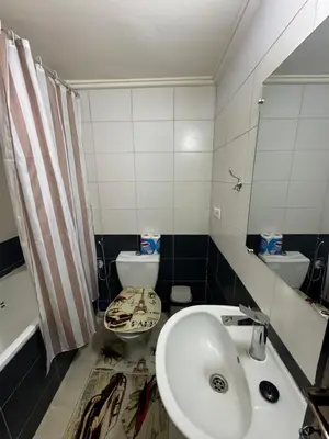 a bathroom with a sink and a toilet at Downtown Fez Delight Apartment in Fès