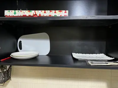 a white toaster sitting on a black counter top at Downtown Fez Delight Apartment in Fès