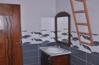a bathroom with a sink and a mirror at Amira Suite Double with Bathroom in Fès