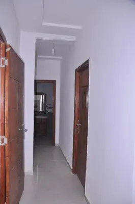 an empty room with two doors and a hallway at Amira Suite Double with Bathroom in Fès
