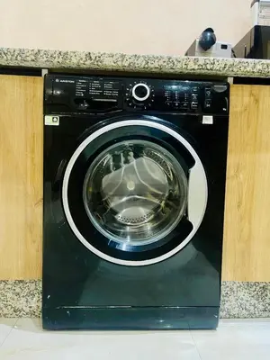 a washing machine with its door open in a kitchen at Villa de la famille, with Private pool in Marrakech