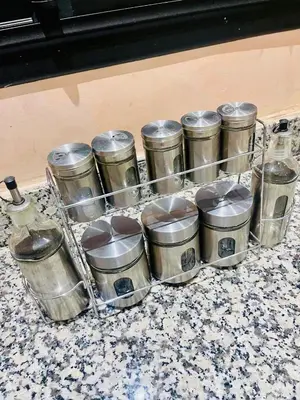 a bunch of silver containers sitting on a counter at Villa de la famille, with Private pool in Marrakech