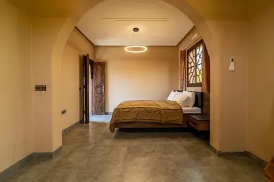 a bedroom with a bed and a window at Villa a Marrakech with private pool in Marrakech