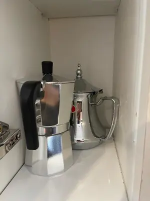a coffee pot sitting on top of a kitchen counter at Luxueux Appartement Parc Champs de Cours avec Wifi Fibre 200 Mo in Fès