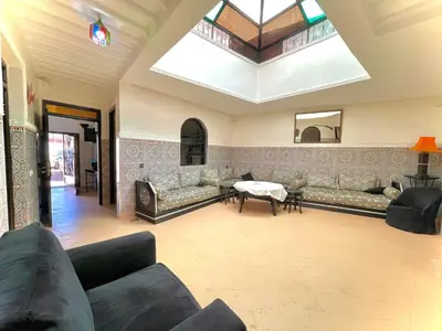 a large living room with couches and a skylight at Niche paradis in Aghmat